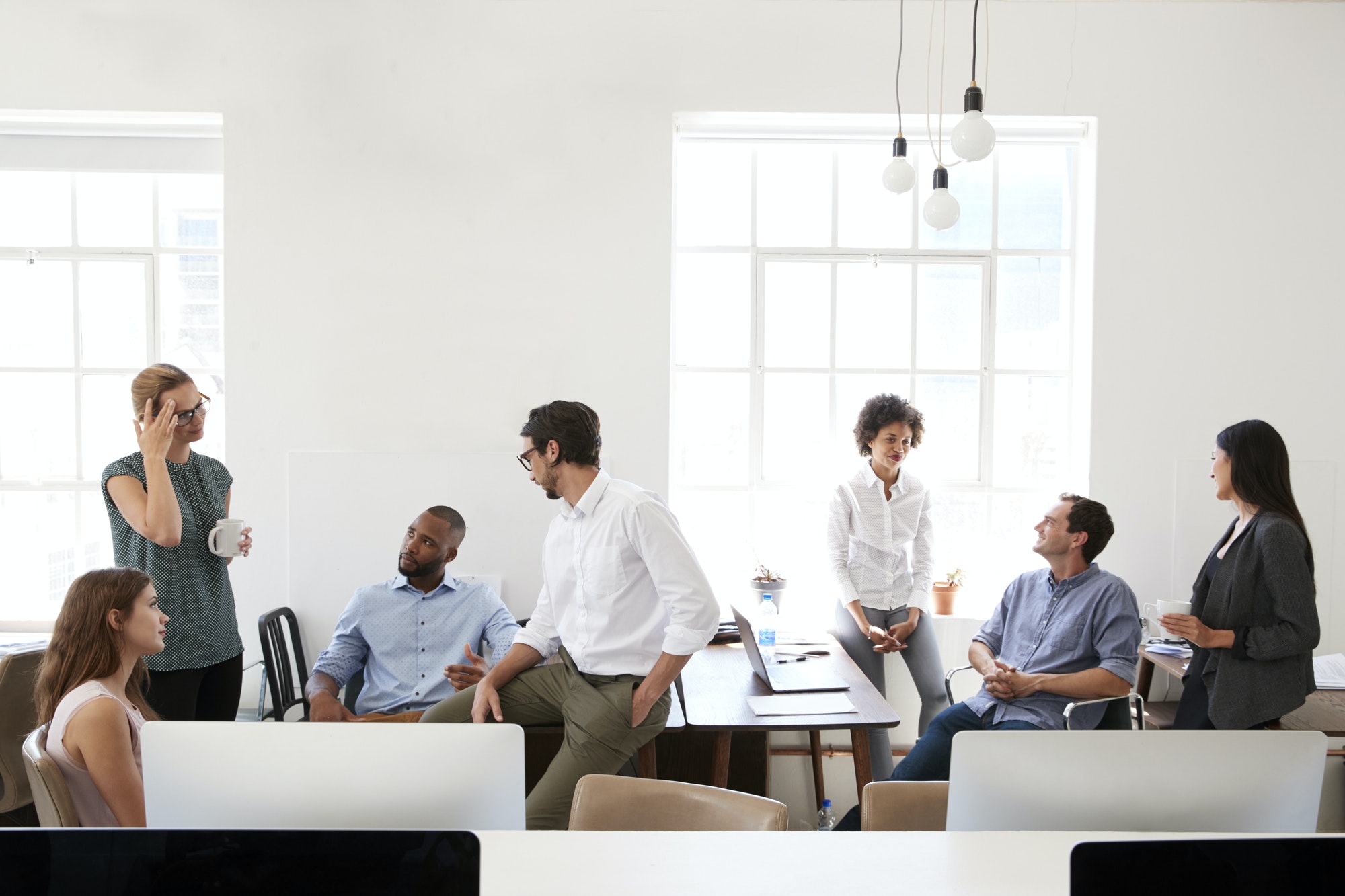 Young business group in discussion in their office